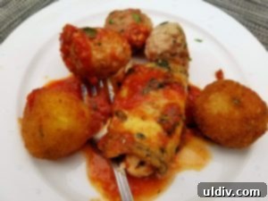 Patio Perfection: Trattoria Gianni's Authentic Italian Escape 3 A platter of classic Italian appetizers including meatballs, arancini, and stuffed eggplant at Trattoria Gianni