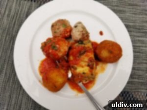 Patio Perfection: Trattoria Gianni's Authentic Italian Escape 4 Close-up of generously sized Italian meatballs in marinara sauce from Trattoria Gianni