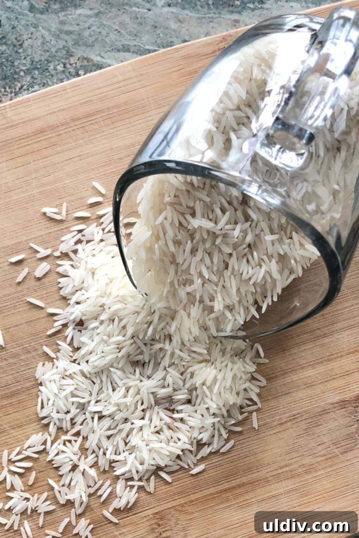 Foolproof Fluffy White Rice 4 A close-up of uncooked long-grain white rice, showing individual grains.