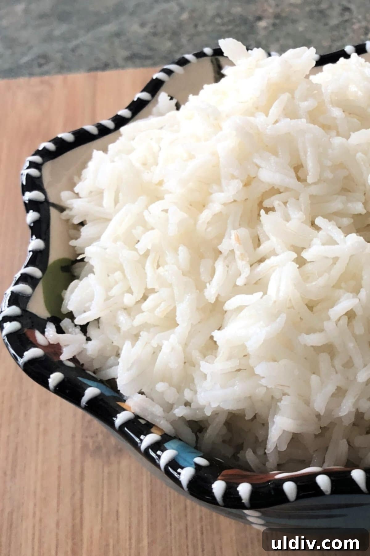 Foolproof Fluffy White Rice 6 A close-up of a bowl filled with perfectly cooked, fluffy white rice.