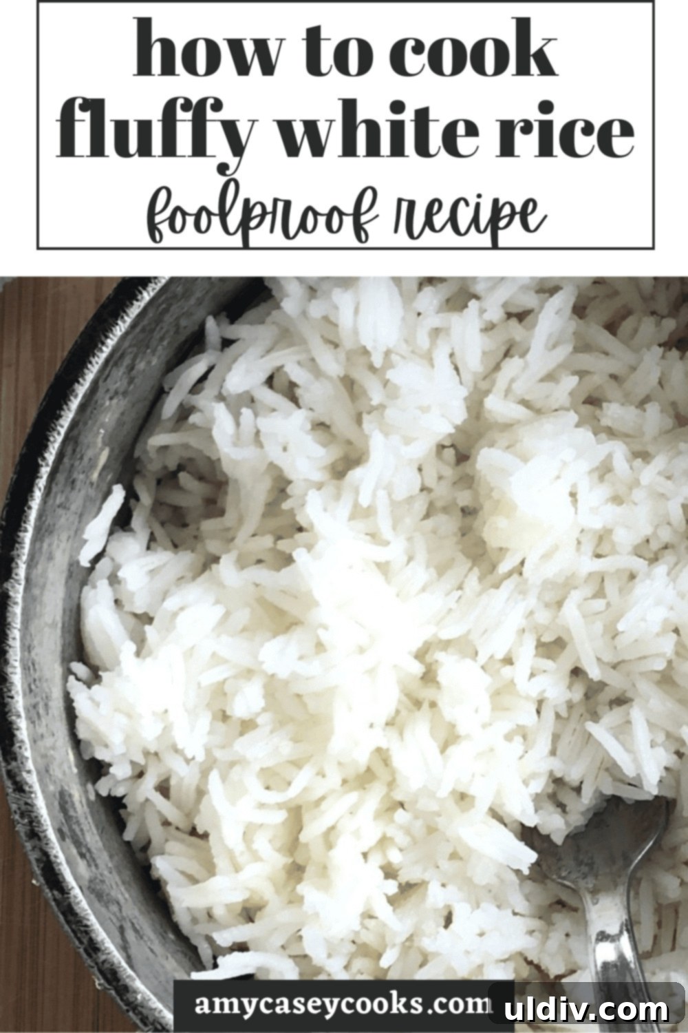 Foolproof Fluffy White Rice 7 A pot on the stovetop filled with freshly cooked, fluffy white rice.