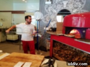 Forno Rosso Pizzeria: Pizza or Panuozzo? Why Not Both! 3 The impressive wood-burning pizza oven at Forno Rosso, a symbol of Neapolitan authenticity.