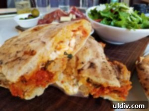 Forno Rosso Pizzeria: Pizza or Panuozzo? Why Not Both! 9 The Polpette panuozzo, cut open to reveal its delicious fillings, ready for enjoyment.