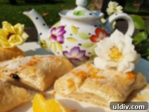 Nielsen-Massey Review & Giveaway: Elevating Every Baked Delight 2 Freshly baked orange ricotta strudel cooling on a rack, radiating a warm, inviting glow.