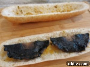 Summer's Secret Goodbye: The Ultimate Grilled Veggie Sandwich 13 Grilled potato slices being added to the sandwich