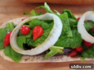 Summer's Secret Goodbye: The Ultimate Grilled Veggie Sandwich 16 Emmental cheese and grilled pepper slices being added