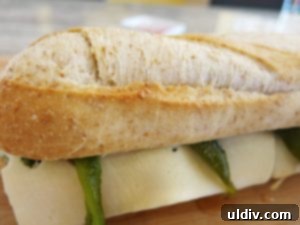 Summer's Secret Goodbye: The Ultimate Grilled Veggie Sandwich 19 Finished grilled vegetable sandwich, cut in half and served warm