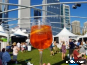 A Decade of Deliciousness: Chicago Gourmet 2 An inviting aerial view of the vibrant Chicago Gourmet festival grounds in Millennium Park, bustling with attendees and culinary tents.