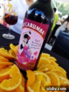 A Decade of Deliciousness: Chicago Gourmet 17 A tall, refreshing glass of premium red sangria, garnished with fresh fruit, offering a perfect respite on a warm day.