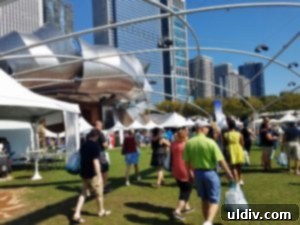 A Decade of Deliciousness: Chicago Gourmet 4 A wide shot of the lively Chicago Gourmet festival, with numerous white tents, smiling faces, and people enjoying the culinary offerings.