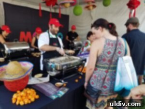 A Decade of Deliciousness: Chicago Gourmet 8 Yucatan-based chefs expertly preparing and serving regional Mexican dishes at the bustling Mexico tasting pavilion.