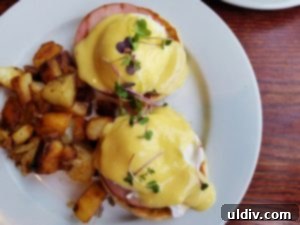 Close-up of the perfectly crafted hollandaise sauce on Eggs Benedict
