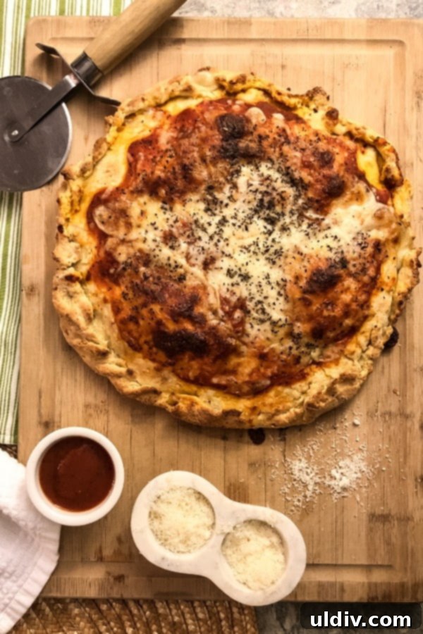 Mastering Authentic Stuffed Pizza 2 Whole stuffed pizza on cutting board, showcasing its impressive height and golden-brown crust.