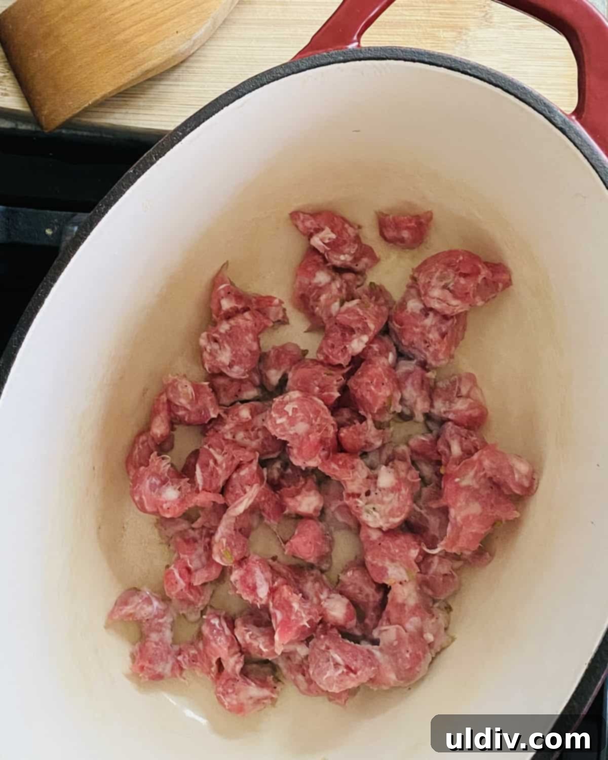 Browning Italian sausage in a large stock pot