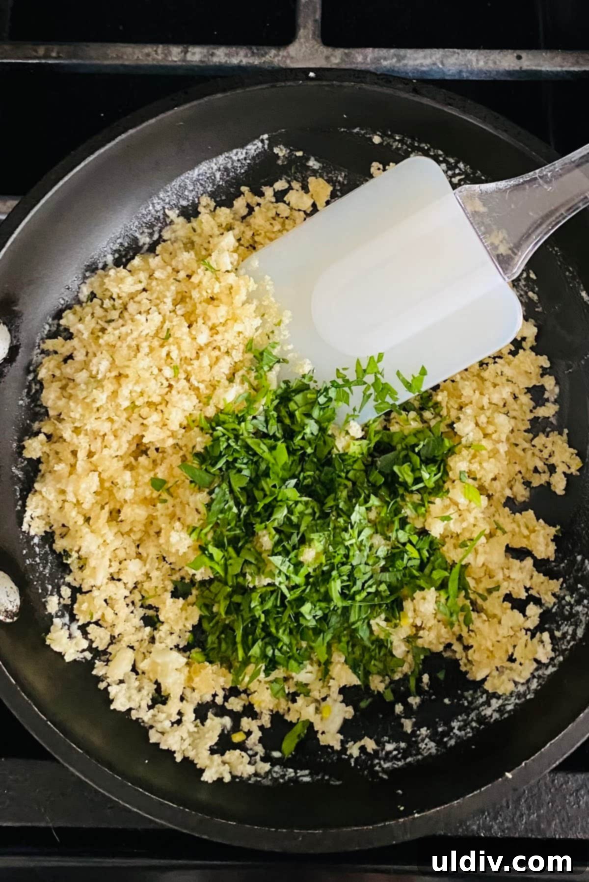 Golden-Crisp Garlic Herb Panko Baked Cod 6 Plain panko breadcrumbs and fresh chopped parsley being added to the fragrant garlic butter in a pan, ready to be mixed.
