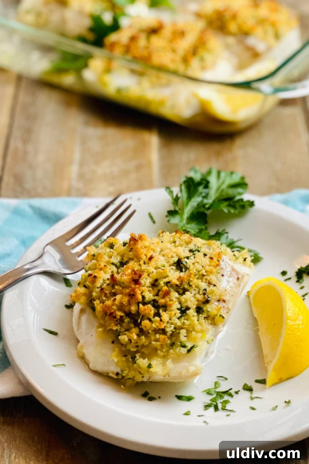 Golden-Crisp Garlic Herb Panko Baked Cod 10 A perfectly cooked piece of baked cod with a generous, golden, crispy panko topping, ready to be enjoyed.