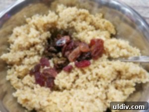 Quinoa Parfait Recipe Wellness in Every Bite 6 Adding crimson red raisins to cooled quinoa pudding