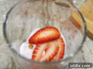 Quinoa Parfait Recipe Wellness in Every Bite 10 Close-up of a parfait layer with sliced strawberries