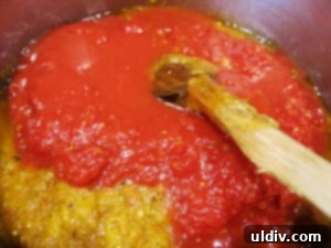 Delicious by Any Other Name 11 A large can of crushed tomatoes being added to the Zacusca mixture in the pot.