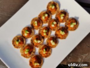 Delicious by Any Other Name 12 Delicious Zacusca served on crackers, garnished with diced cucumber and green onion, ready for a Game Day spread.