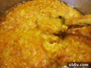 Delicious by Any Other Name 10 The blended roasted vegetable mixture combined with sautéed onions, vegetable oil, bay leaves, salt, and pepper in a large pot for Zacusca.