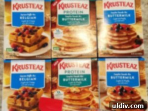 Assortment of Krusteaz pancake and waffle mixes on a table