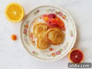 Lemon zest buttermilk pancakes with a colorful citrus salad and hazelnuts