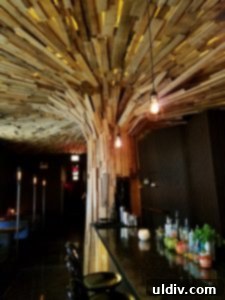 Fort Willow: A Culinary Journey of Boldness and Unforgettable Moments 4 Impressive wooden slat tree sculpture and unique interior design at Fort Willow, creating a cozy treehouse atmosphere