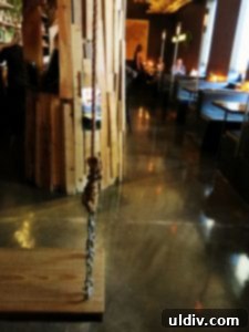 Fort Willow: A Culinary Journey of Boldness and Unforgettable Moments 5 Whimsical swing hanging from the wooden tree inside Fort Willow restaurant, inviting playful interaction