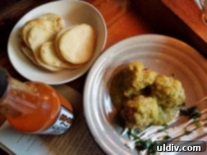 Fort Willow: A Culinary Journey of Boldness and Unforgettable Moments 6 Delicious pork meatballs with hatch green chilies and vibrant salsa verde, served with cooling sour cream at Fort Willow