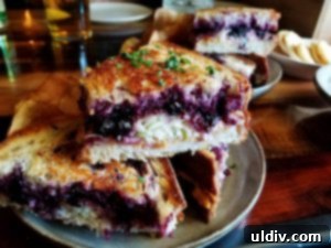 Fort Willow: A Culinary Journey of Boldness and Unforgettable Moments 7 The unique PBJ4 Big Bite sandwich with sriracha peanut butter, blueberry jam, muenster, and slaw, served with homemade chips