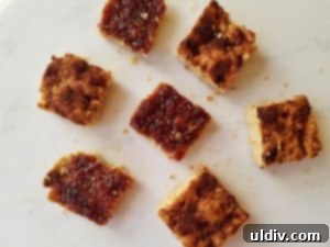 Close-up of freshly baked Raspberry Crumble Bars and Apple Pie Blondies on a plate