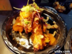 WingFest 2018 A Flavorful Dash Against Time 9 Spicy garlic parmesan wings from Paisans Pizzeria, generously coated in cheese, a delight for cheese lovers.