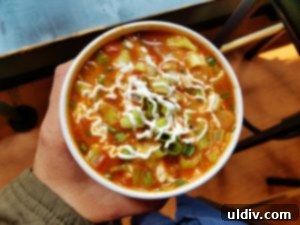 Summer Chill Shakes and Gazpacho 4 Zoup!'s Avozpacho, a creamy green soup topped with sour cream and fresh herbs.