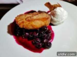 Culinary Fight Club Finale: Pork, Pastry, and Pure Passion 13 Chef Ryan Rondeno's elegant apple fritter with charred blueberry compote, a sweet finale prepared for the public at The Final Plate.