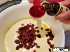 Nielsen Massey Summer Finale Review and Giveaway The Scent of Vanilla 3 Pound cake batter mixed with dried cranberries and ready for the oven.