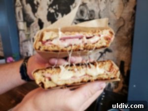 Coffee Joint's Ham & Swiss sandwich, crafted with Black Forest ham, Wisconsin Swiss cheese, and white wine Dijon mustard on toasted multigrain bread.