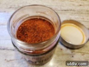 Harissa-rubbed pork chops marinating