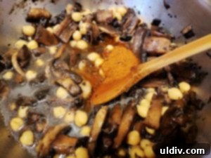 Mushrooms and chickpeas seasoned with harissa