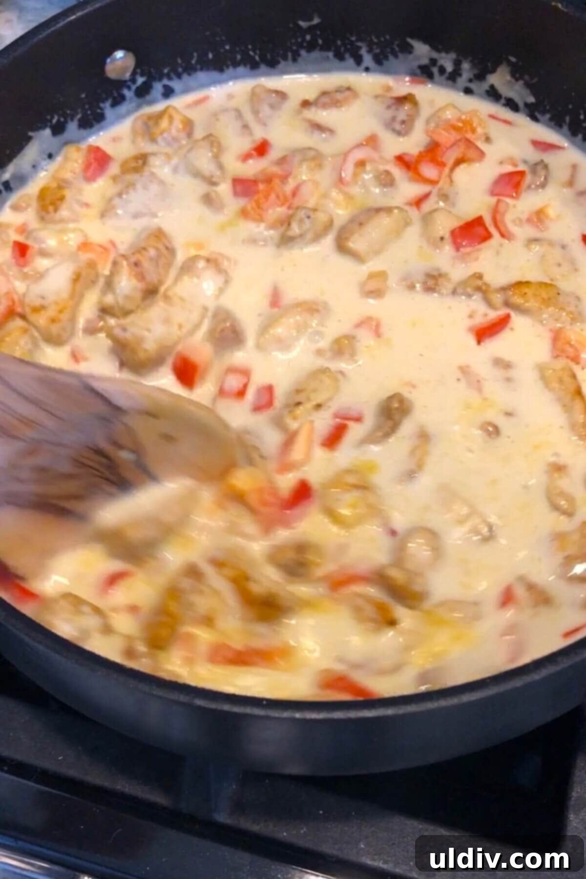Velvety Thai Coconut Chicken Curry 6 stirring coconut curry sauce.