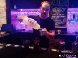Mezcalito's chief mixologist demonstrating the steps for creating the 'Scaredy Cat' cocktail