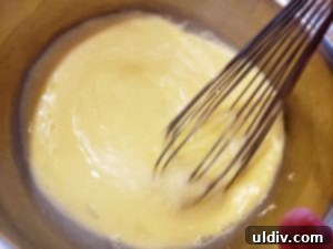 Nielsen-Massey Vanilla Dreams: My Spring Crêpe Casserole Recipe 4 Mixing eggs, milk, and sugar for crêpe batter