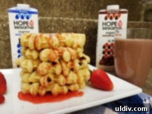 Hope & Sesame Waffle Recipe, Review, and Mother's Day Giveaway 8 A close-up of a stack of waffles with strawberries, showcasing the texture and deliciousness