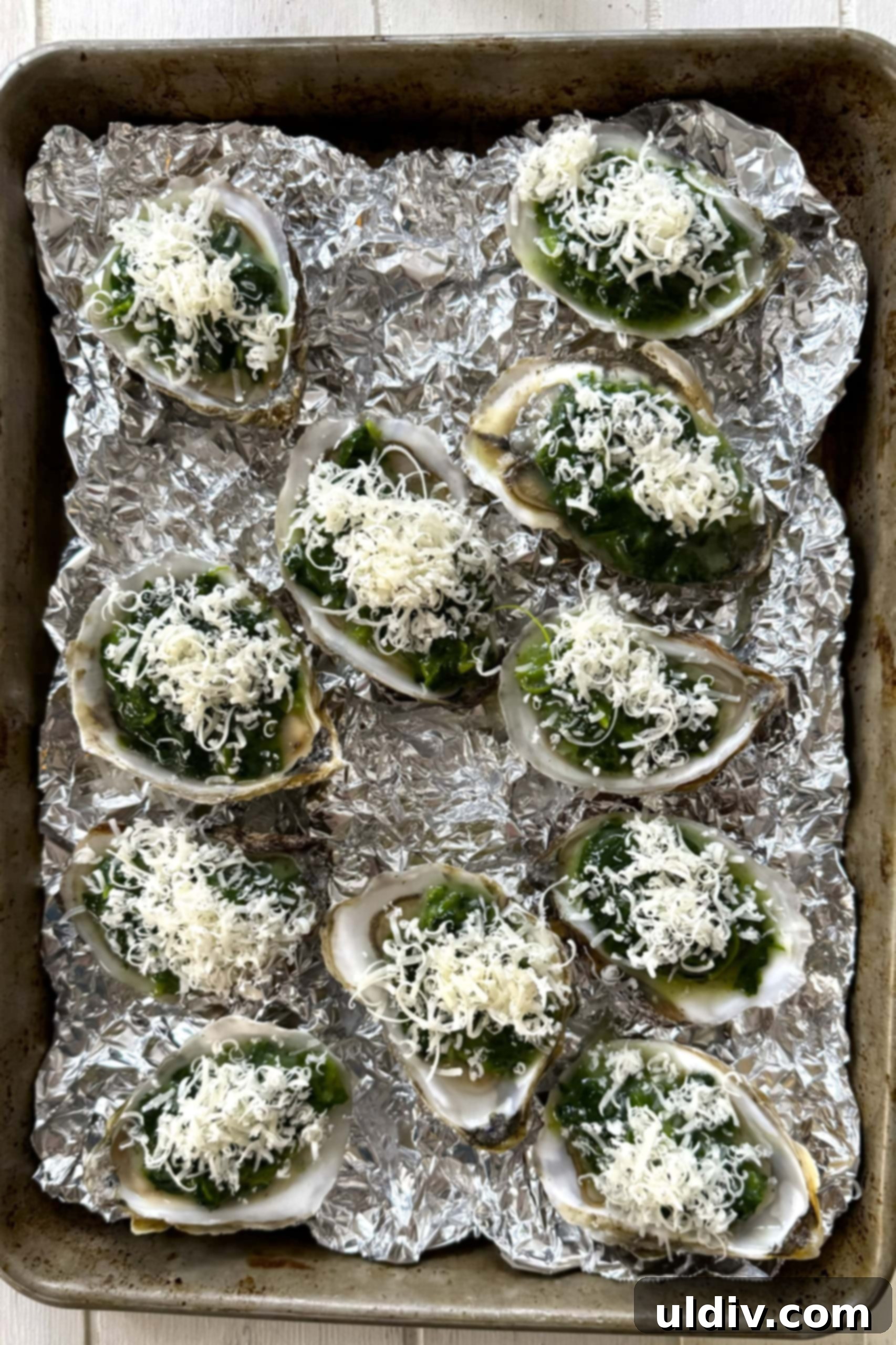 Indulgent Oysters Rockefeller 9 Unbaked oysters Rockefeller topped with parmesan cheese and panko.