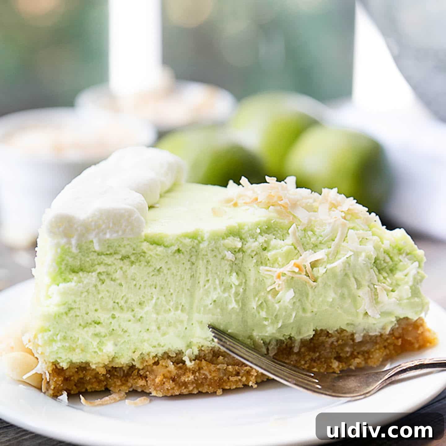 Tangy Key Lime Cheesecake Recipe with Graham Cracker Crust 3 slice of key lime cheesecake on a plate