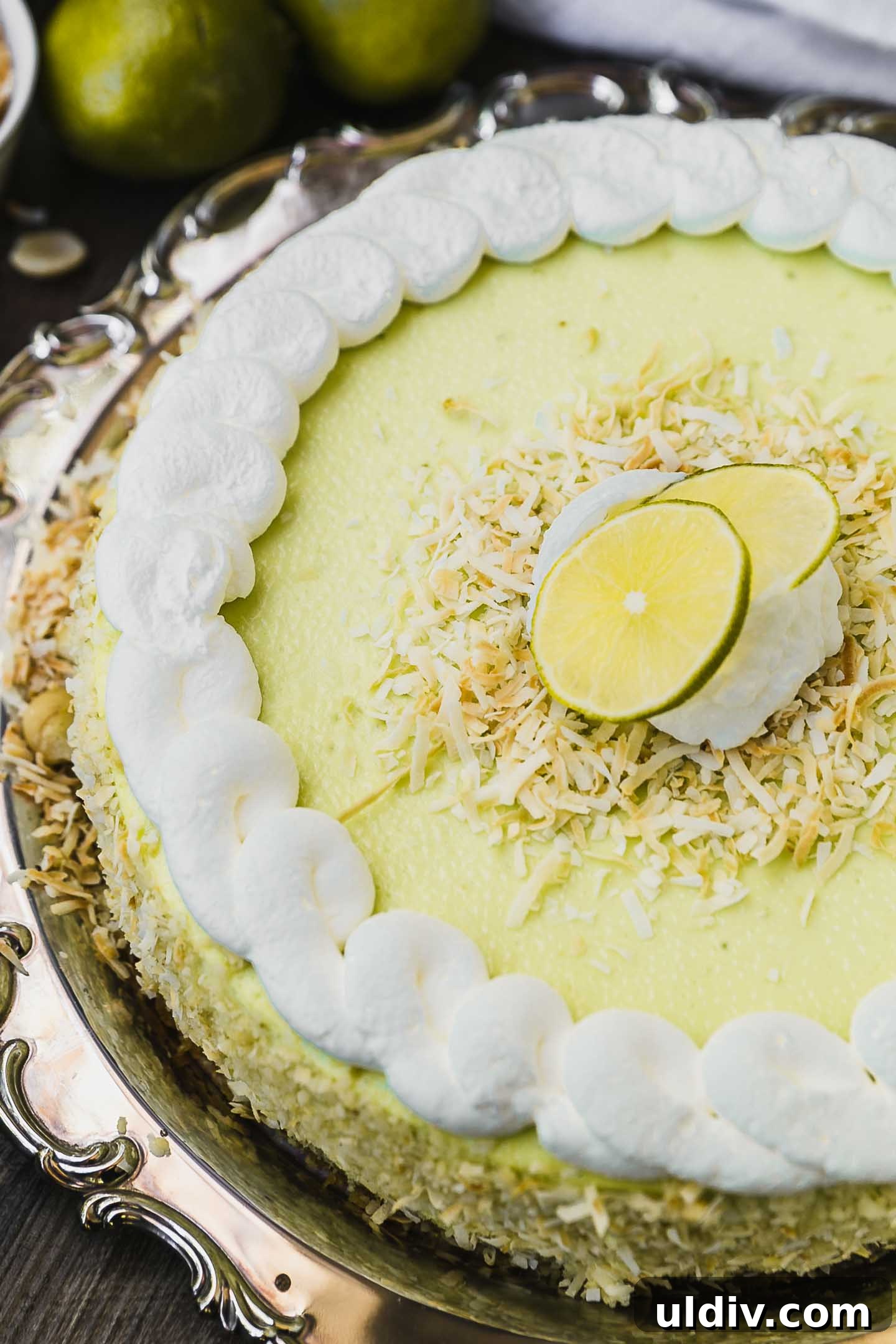 Tangy Key Lime Cheesecake Recipe with Graham Cracker Crust 4 key lime cheesecake on a serving platter.