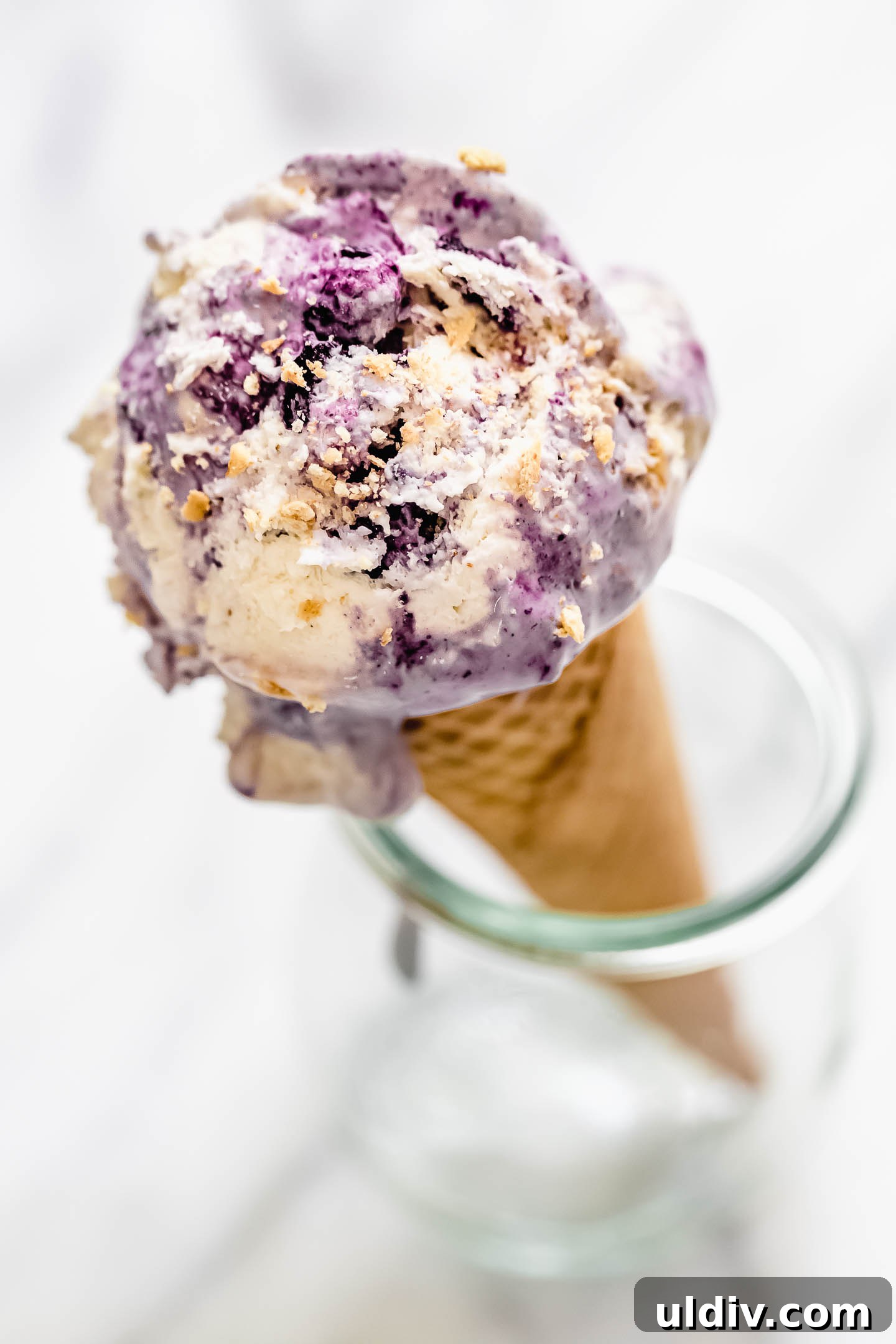 Blueberry Pie Ice Cream Recipe — Creamy Homemade Dessert 2 Blueberry Pie Ice Cream on a cone
