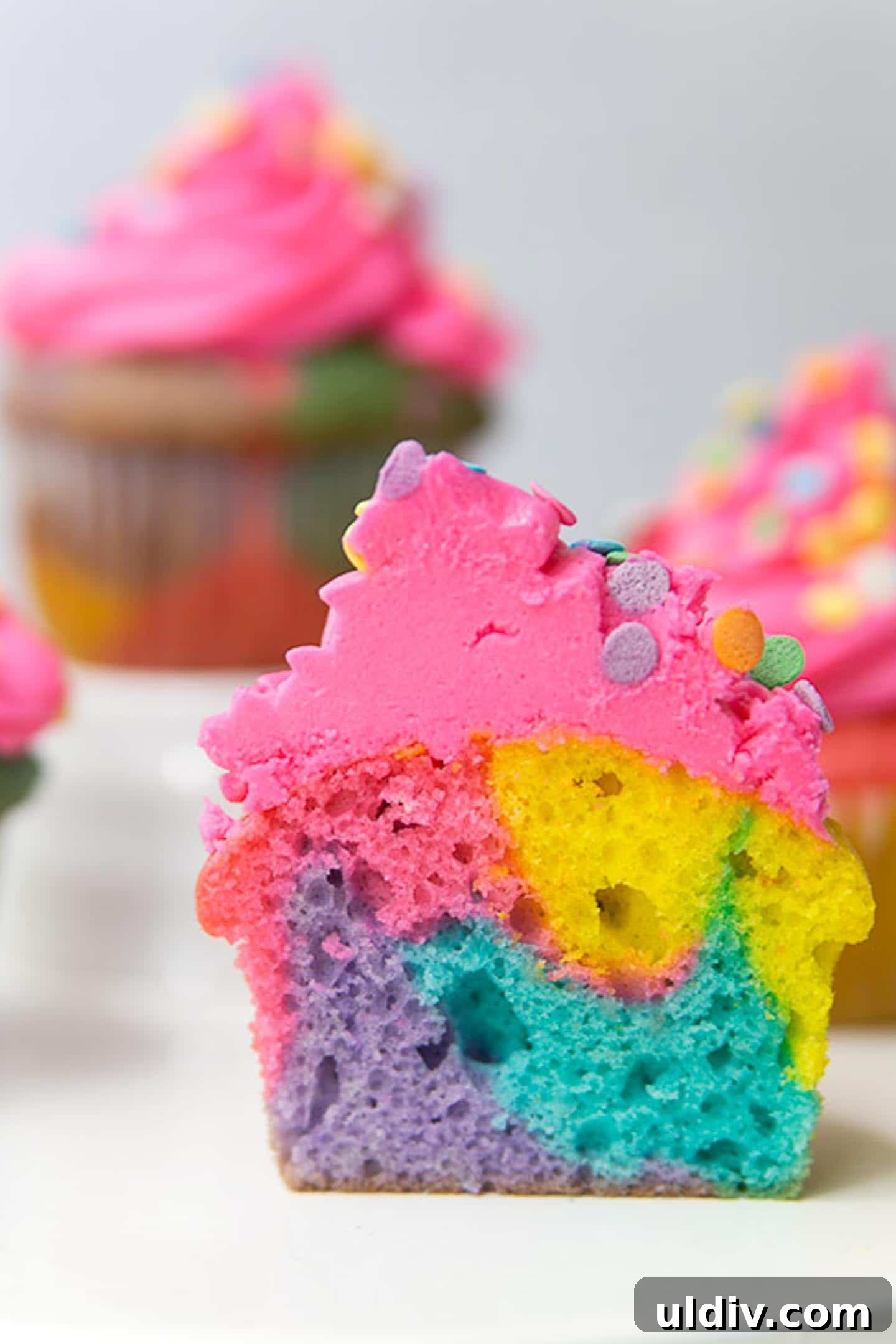 How to Make Colorful Rainbow Cupcakes: Step-by-Step Recipe 5 A rainbow marble cut in half to see the inside of the cupcake.
