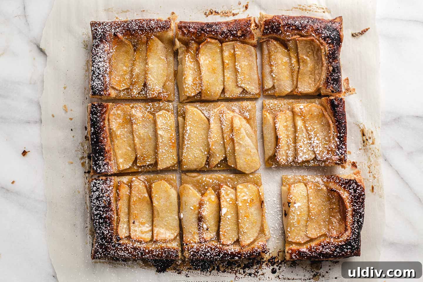 Rustic Apple Tart Recipe: Flaky, Cinnamon-Spiced Orchard Tart 6 Apple tart cut into nine squares.