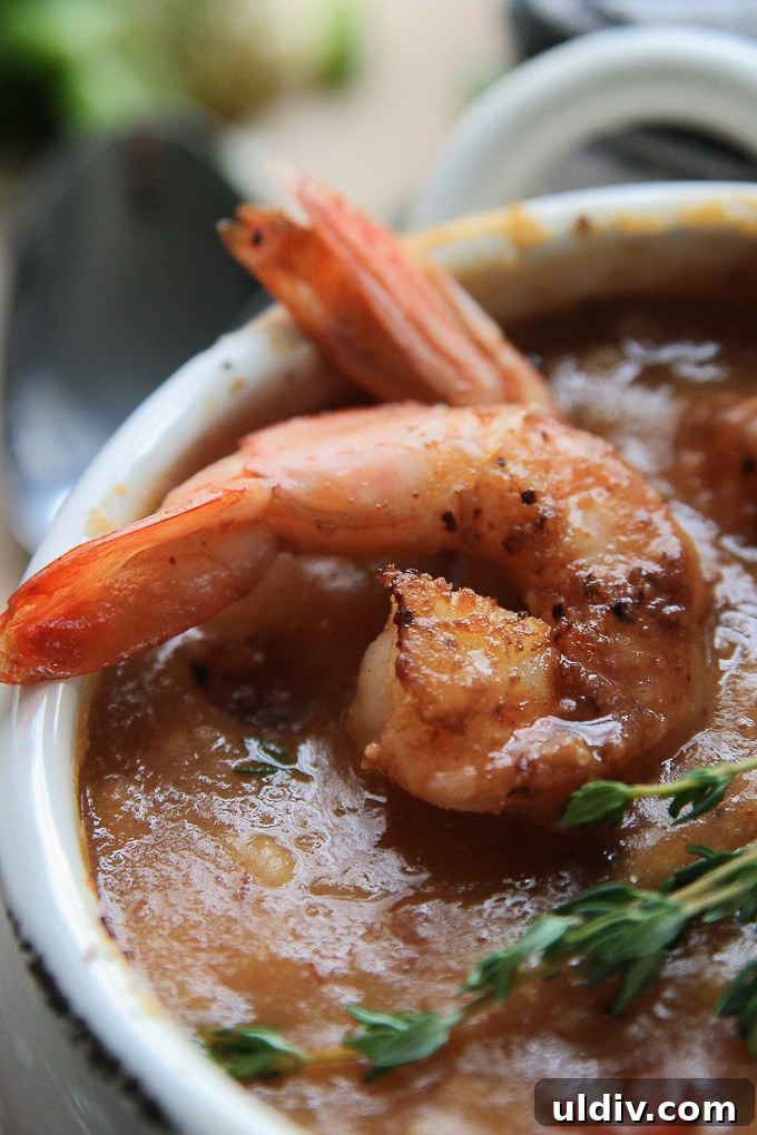 Bowl of Cajun Shrimp Chowder topped with blackened shrimp. shrimp in a bowl of chowder